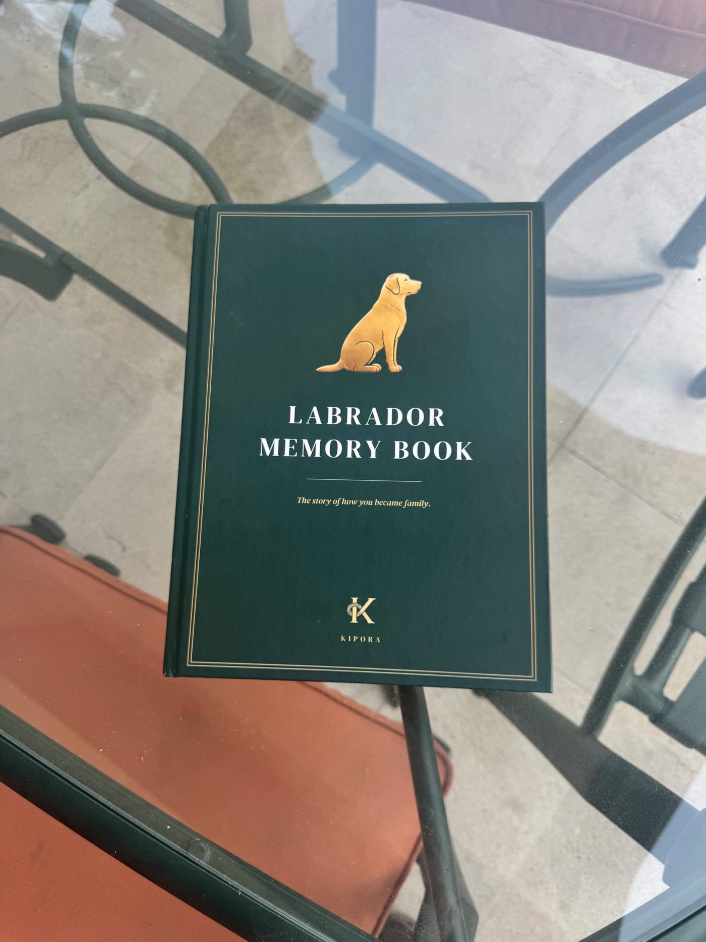 Labrador Memory Book photographed on a glass table