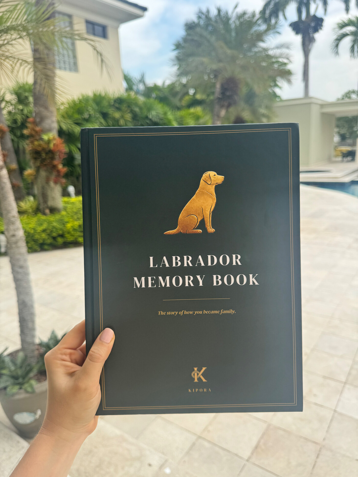 Labrador Memory Book hardcover held outdoors